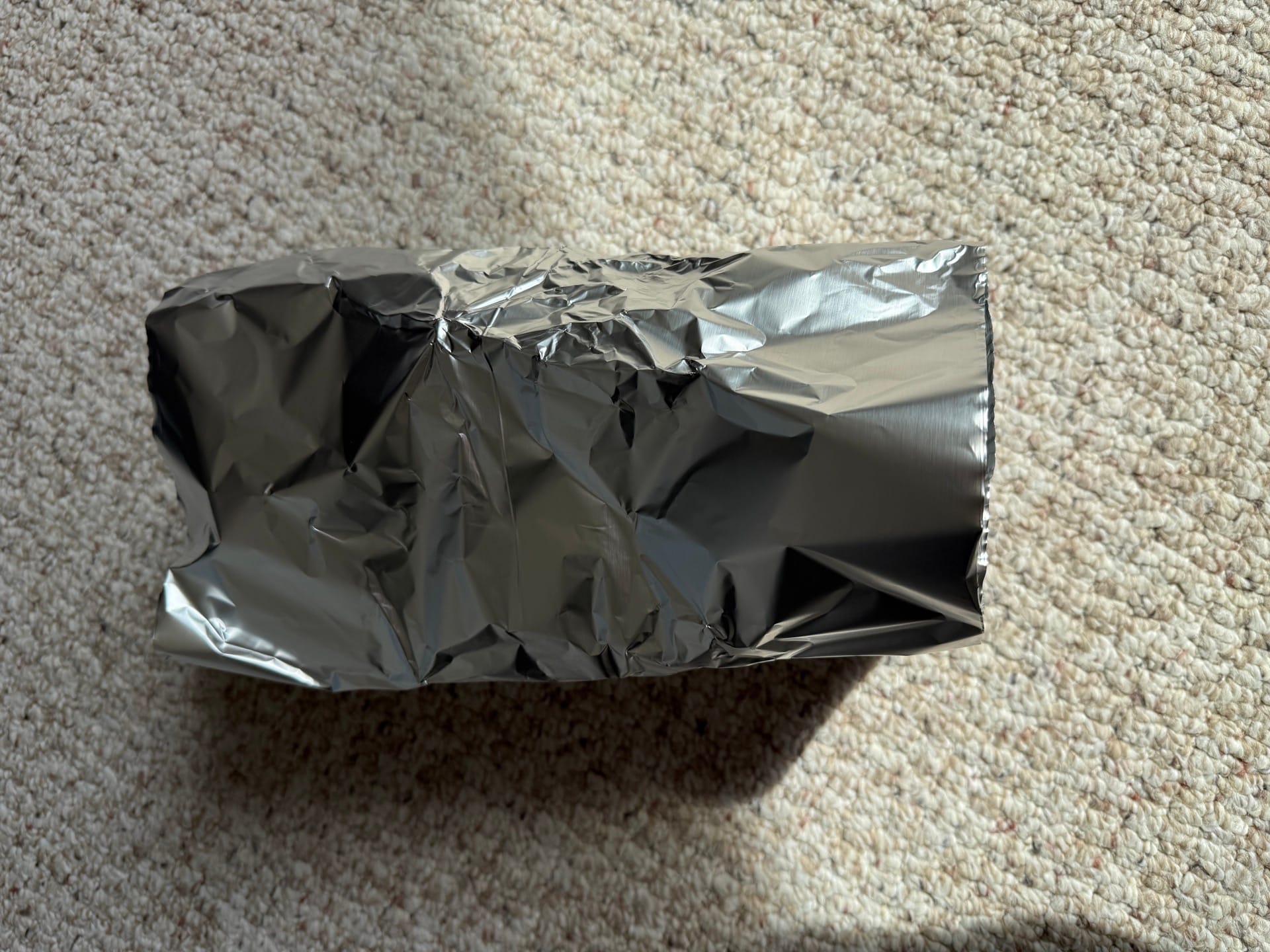 Device fully wrapped in aluminum foil to simulate a sealed metal enclosure